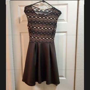 Black and nude mini dress with lace keyhole back